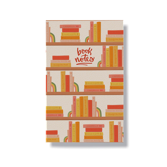 Book themed notebook sized at 5.5x8.5 inches and contains 60 lined pages. Cover features hand drawn illustrations of book shelves full of colourful books.