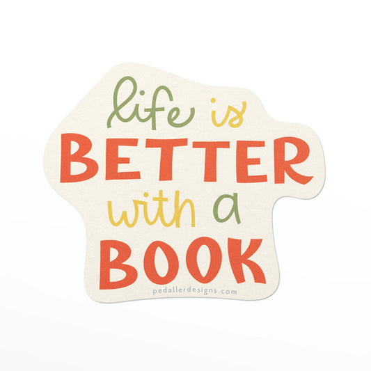Book themed vinyl sticker with the hand lettered text, "life is better with a book" in green, yellow and red.