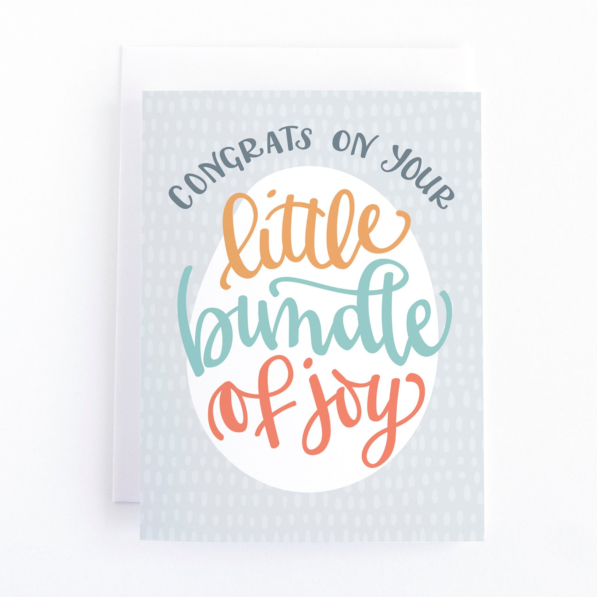 gender neutral new baby card featuring the message, congrats on your little bundle of joy in multi-coloured lettering on a gray background.
