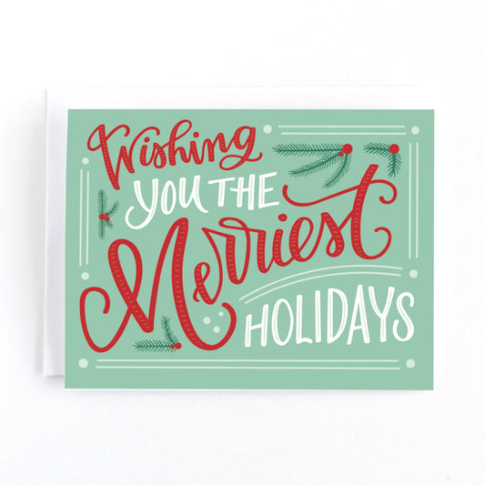 Christmas card with a mint and red colour palette and vintage inspired lettering saying, wishing you the merriest holidays