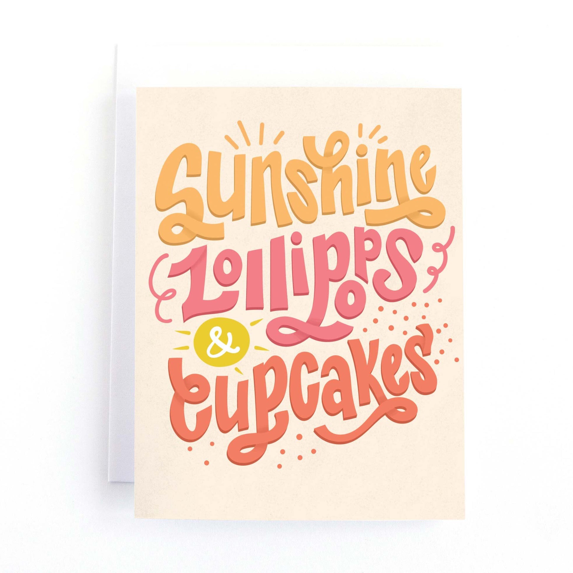 hand lettered birthday card with the text Sunshine, lollipops and cupcakes in a warm and sunny colour palette