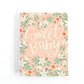 Baby shower card featuring the hand lettering greeting, "Sweet Baby" on a pink background with white orange blossoms.