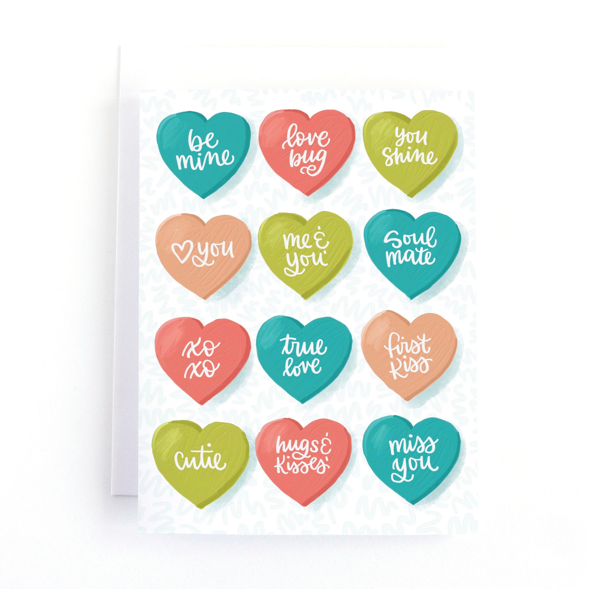 Valentine's day card with multicoloured illustrations of conversation heart candies on a white background.