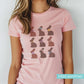 women's pink easter graphic tee with illustrations of chocolate bunnies.