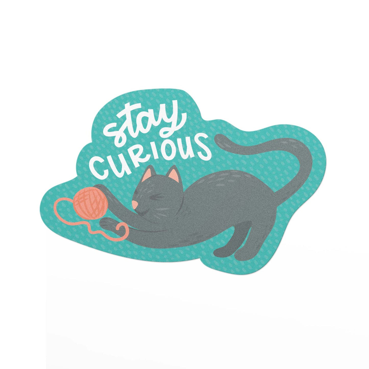 Durable vinyl sticker featuring a cat playing with and ball of yarn and the hand lettered text, Stay curious