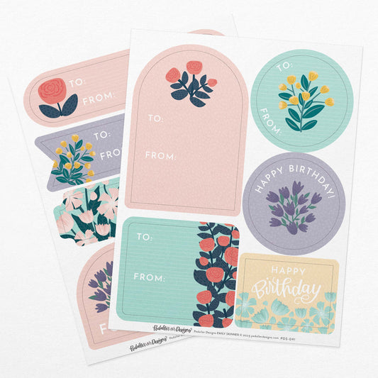 Floral themed gift tag sticker set that includes two sheets of colourful stickers with a variety of flowers that can be used as gift tags on presents or gift boxes.