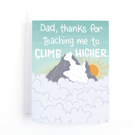 Father's day card with an illustration of a mountain peak poking through the clouds and the text, Dad, thanks for teaching me to climb higher.