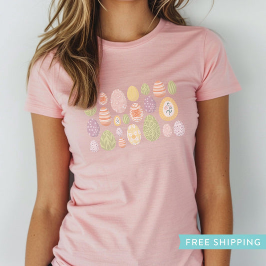 Women's pink graphic t-shirt with illustrations of easter eggs.