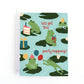 Frog and Pond themed brithday card with frogs wearing party hats on lily pads with balloons, cake and presents and the text, "let's get this party hopping!"
