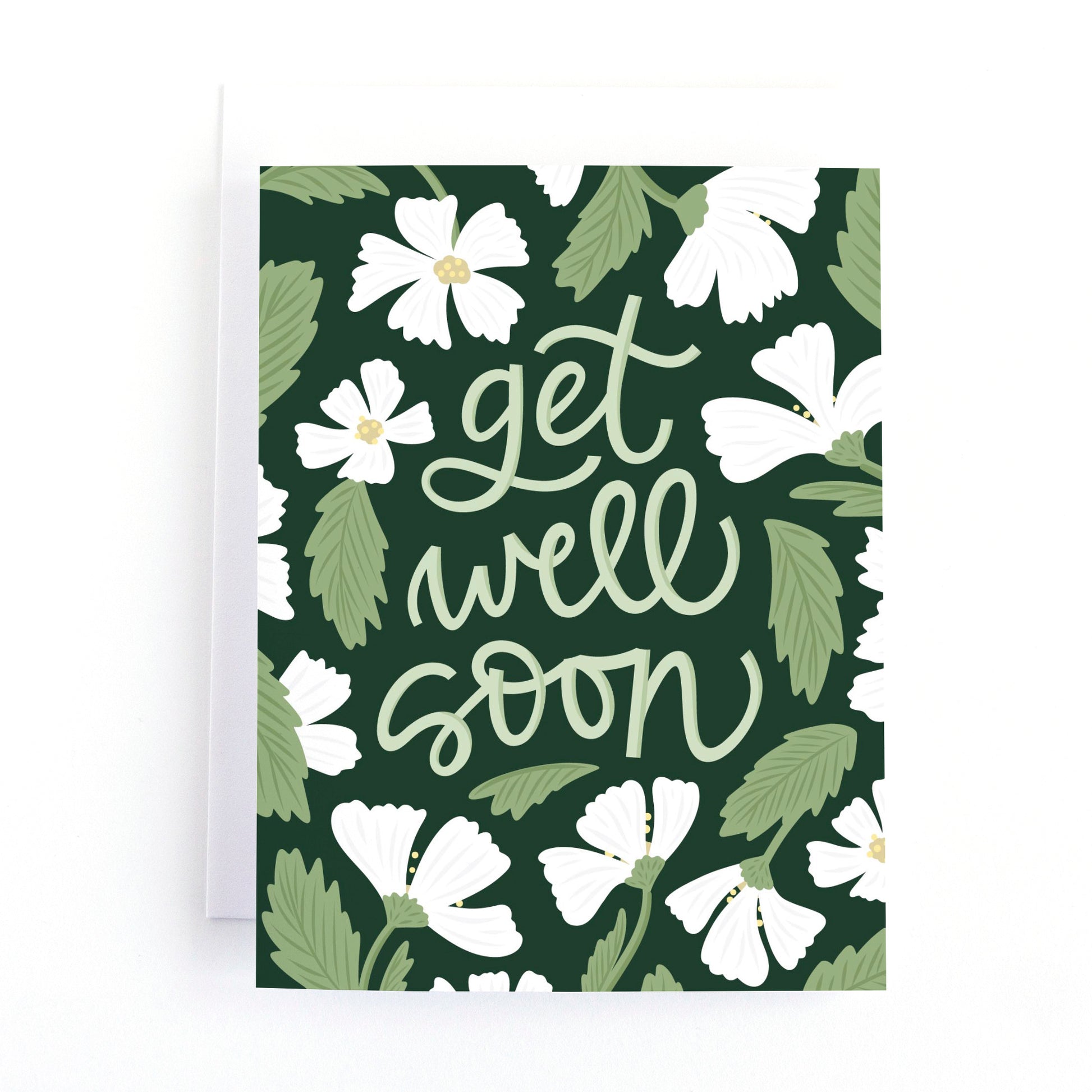 Get Well soon card with delicate white flower stems surrounding the hand lettered greeting, get well soon on a dark green background.