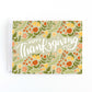 Thanksgiving card with fall florals on a green background and the message Happy Thanksgiving