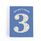 Toddler Third Birthday card with comic book illustrations in the shape of the number 3 on a blue background.