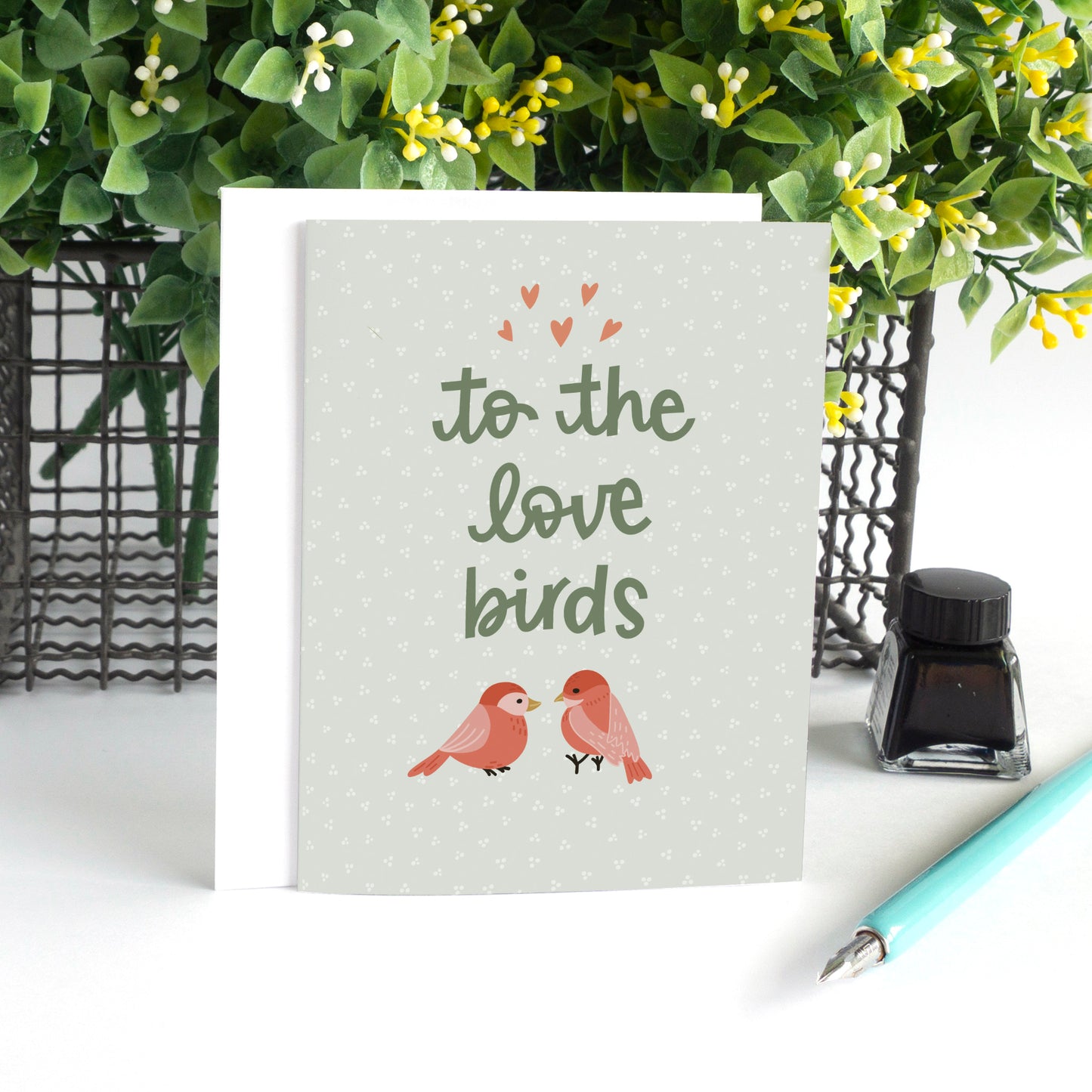 Hand-drawn wedding card with two love birds and “To the Love Birds.” Perfect for nature lovers, woodland weddings, and celebrating love.
