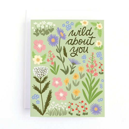 Mountain wildflower themed Love card with the text Wild about you surrounded by hand drawn wild flower illustrations.