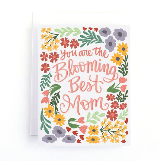 Floral mothers day card with the message you are the blooming best mom surrounded by illustrations of wildflowers in a rainbow of colours.