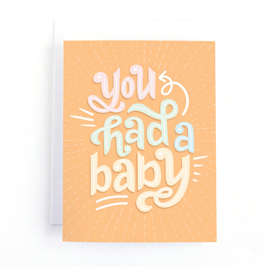 Baby shower card with gender neutral colours and retro lettering that says, You had a Baby!