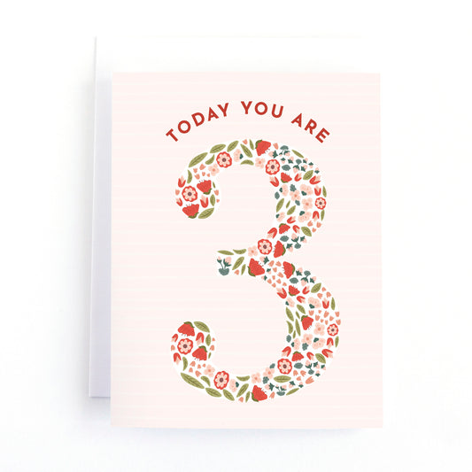 girls third birthday card with tiny flowers and strawberries in the shape of the number 3.