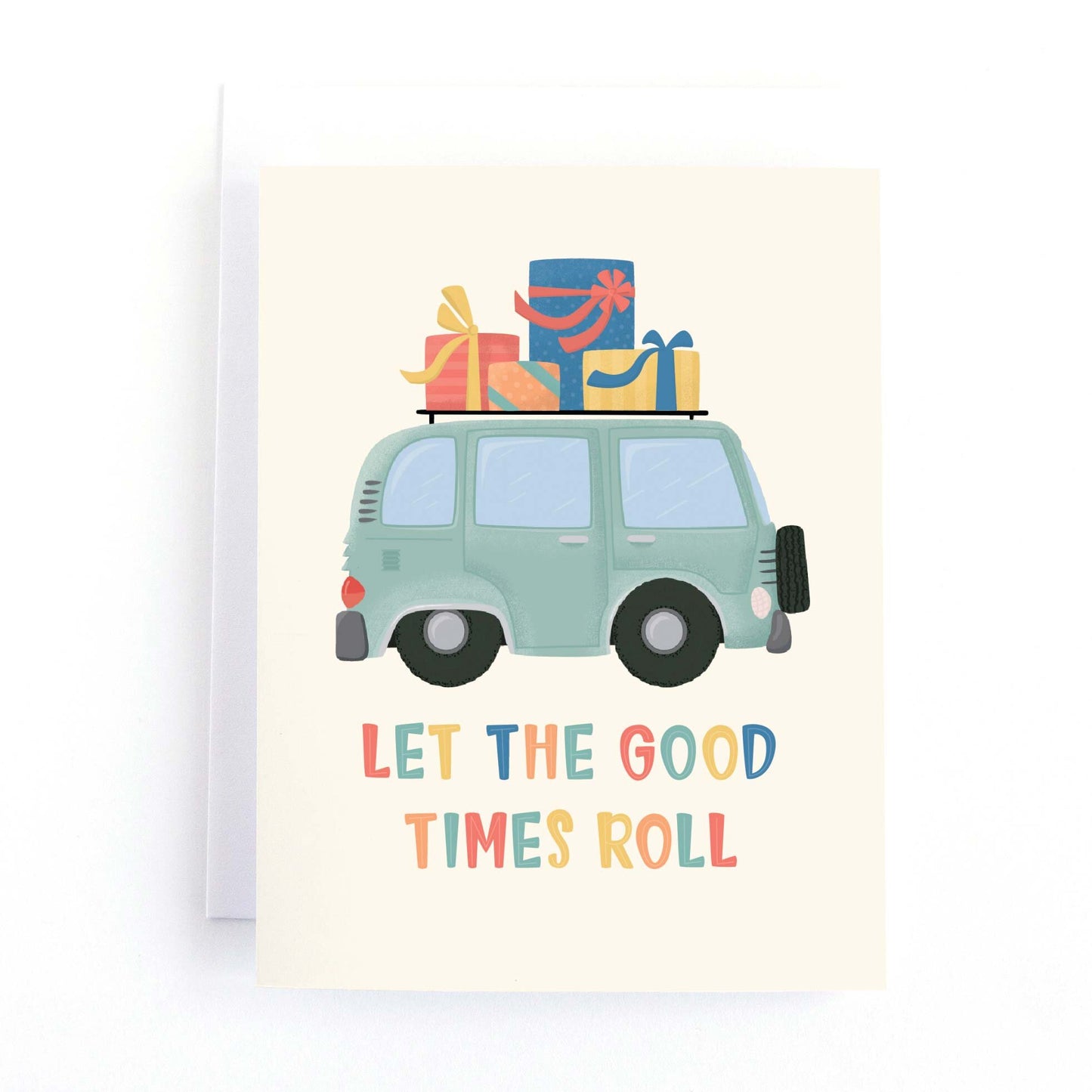 birthday card with an illustration of a green vintage camper van loaded up with presents and the text, let the good times roll