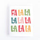 Simple christmas card with colourful lettering that says FA LA LA LA LA LA LA LA