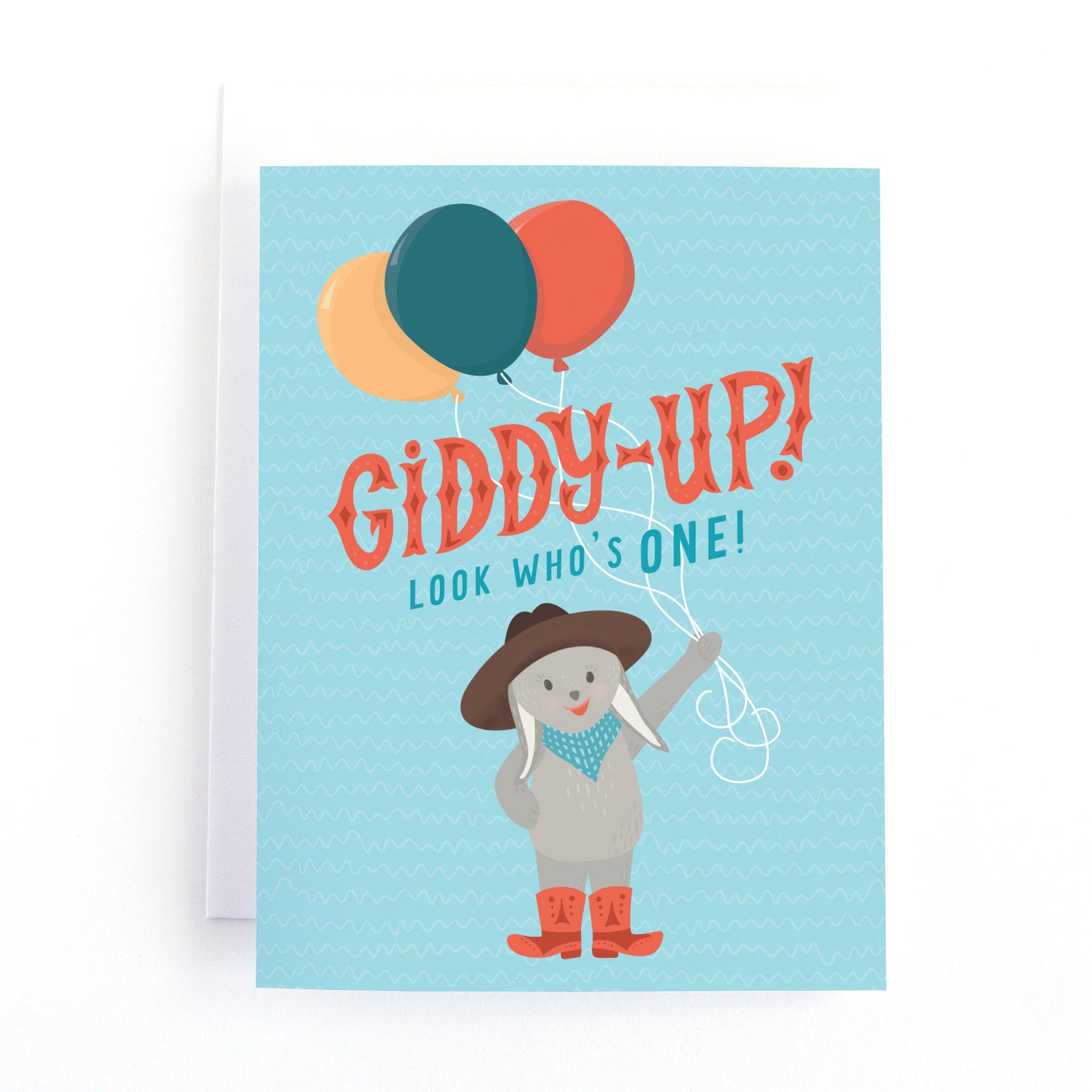 Cute cowboy themed first birthday card  witha bunny rabbit holding a bunch of balloons and the text, Giddy up! look who's one!