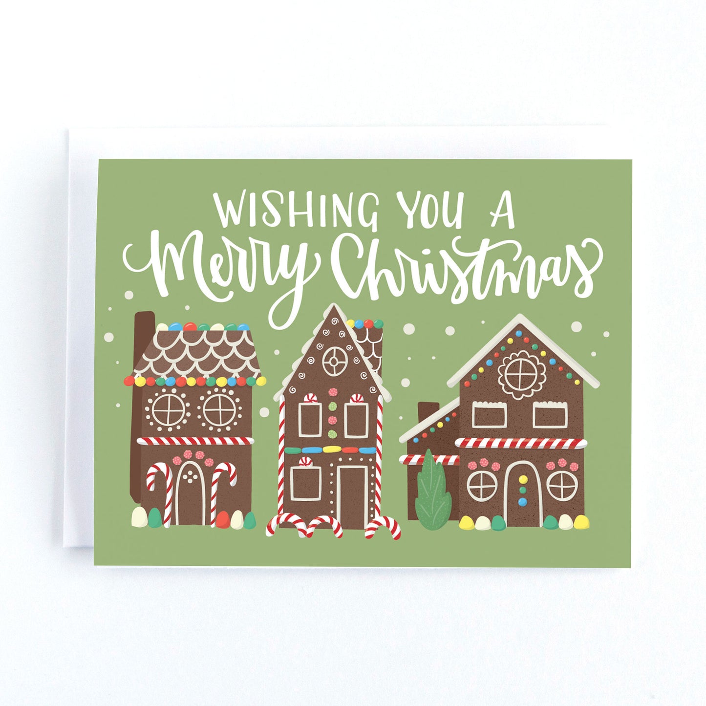 Christmas Holiday card with gingerbread house illustrations and the text, wishing you a merry christmas.