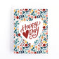 Valentine's Day Card with an intricate frame of flowers around the text happy heart day.