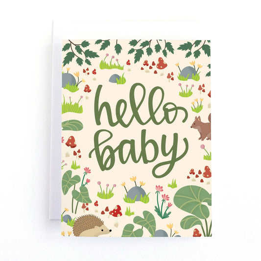 Baby Shower card with woodland forest illustrations including a squirrel, hedgehog and mushrooms and the message hello baby