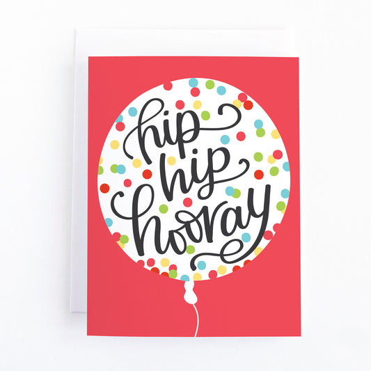 bright red birthday card with a confetti filled balloon and the message, hip hip hooray.