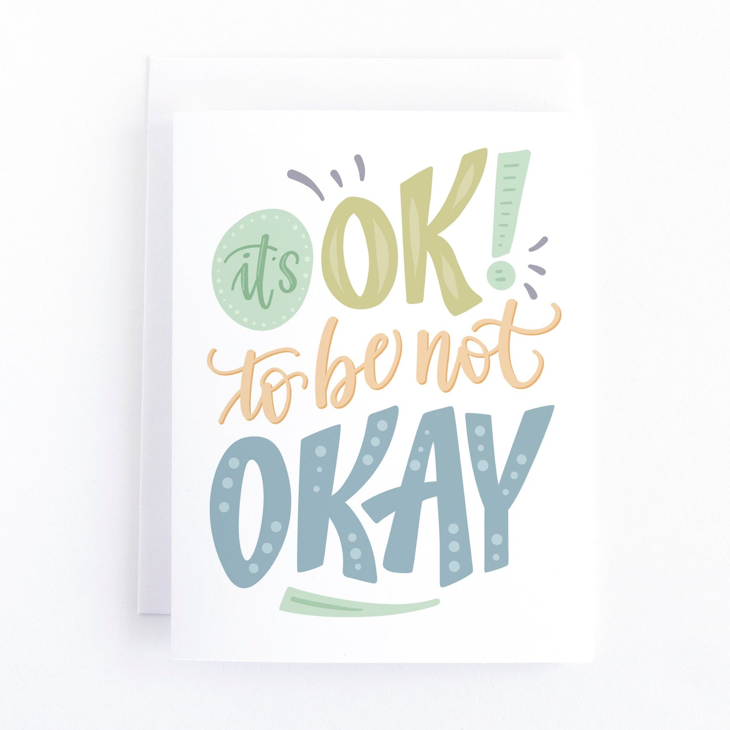 Mental Health support and sympathy card with muted hand lettering and the message, It's Ok to be not OKAY