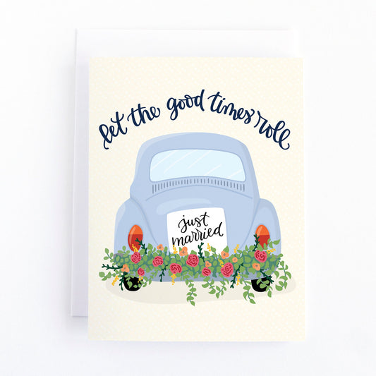 wedding card with a vintage car decorated with flowers and a just married sign and the text, let the good times roll.
