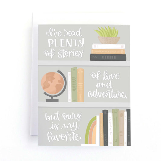 Love and Valentine's Card with and illustration of some modern styled bookshelves and the text, I've read plenty of stories of love and adventure, but ours is my favorite.