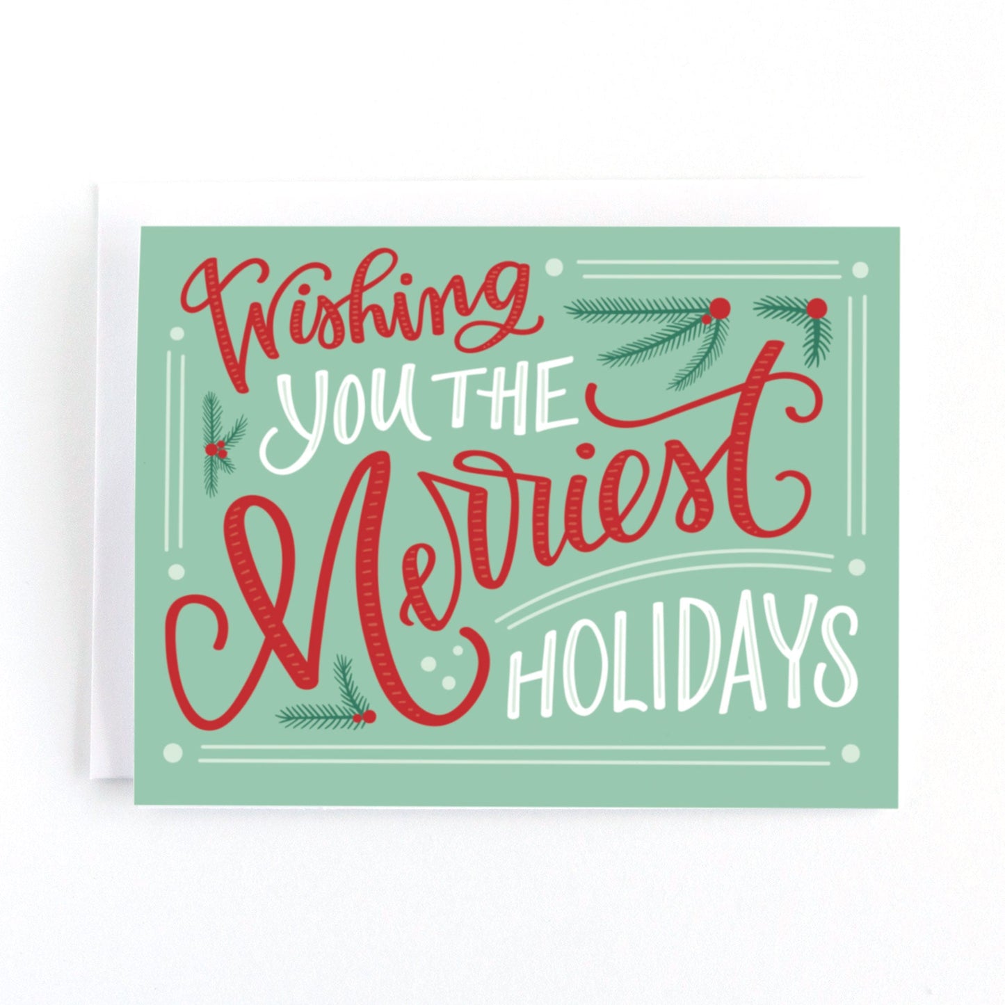 Christmas card with a mint and red colour palette and vintage inspired lettering saying, wishing you the merriest holidays