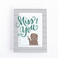 Miss you greeting card with a dog looking out the window and the hand lettered text, Miss you!