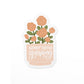 Vinyl sticker with a pink flower pot filled with pink blooms and the text, never stop growing.