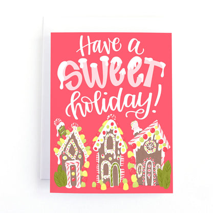 christmas card with illustrations of gingerbread houses overloaded with candy, sweets and icing and the text, have a sweet holiday!
