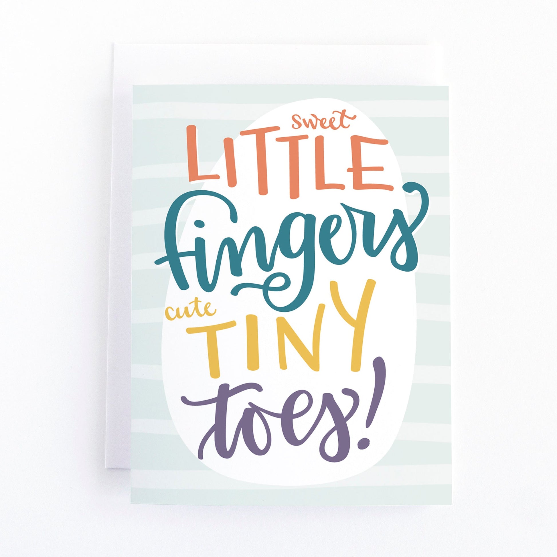 new baby card featuring a hand lettered message "sweet little fingers cute tiny toes" in multi-coloured lettering on a light blue striped background.