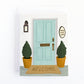 Greeting card to congratulate new home owners featuring a modern and elegant front door step with potted trees and Welcome door mat and a home sweet home sign.