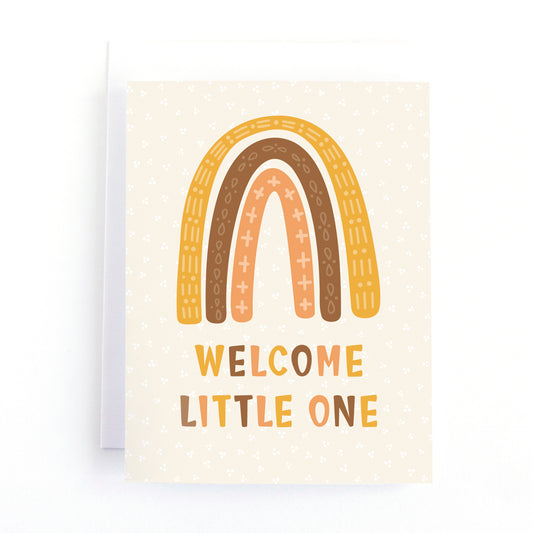 new baby card featuring a warm neutrals colour palette, a boho style rainbow and the message, welcome little one.