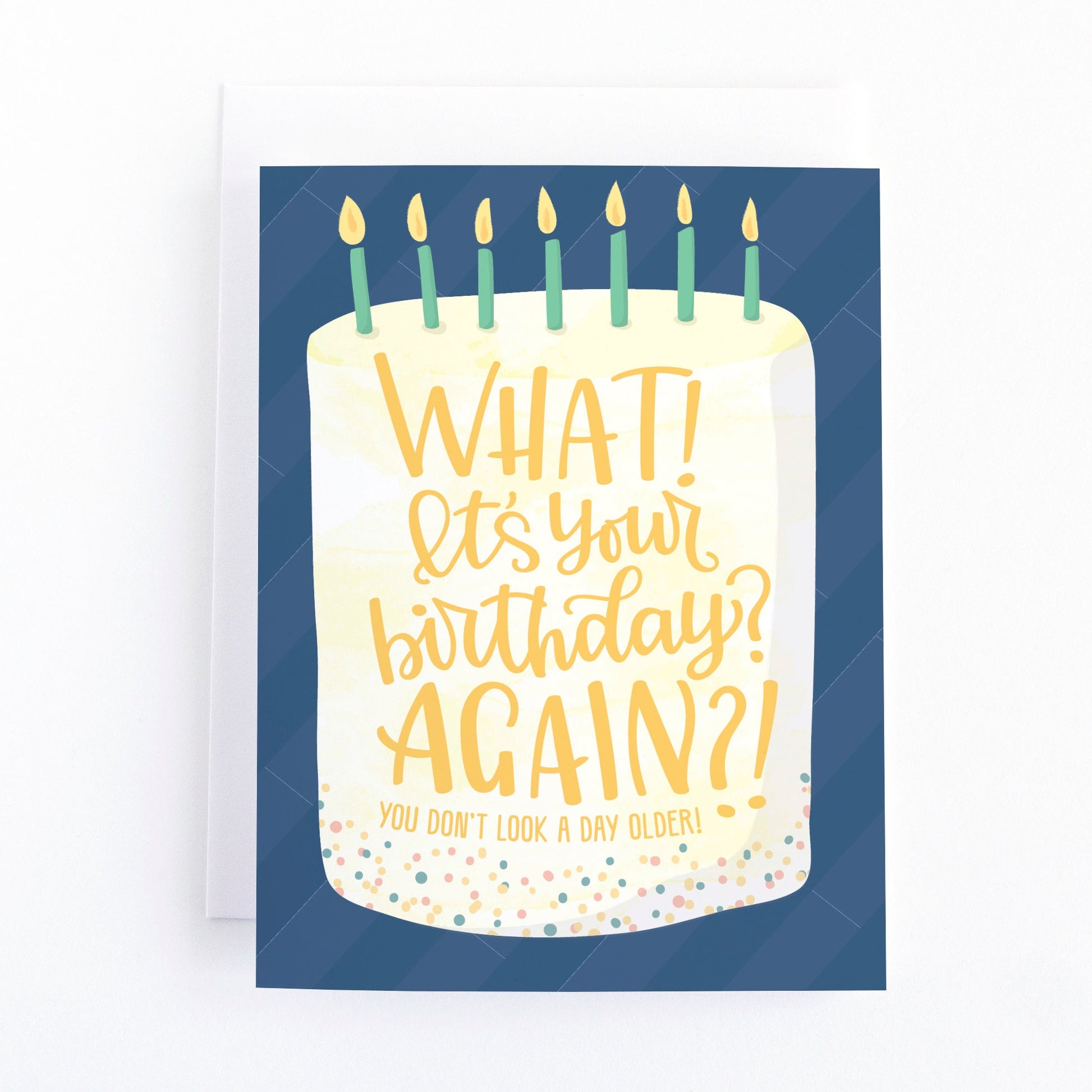funny birthday card that has a hand lettered greeting on a fancy birthday cake that says, What?! It's your birthday? Again? You don't look a day Older