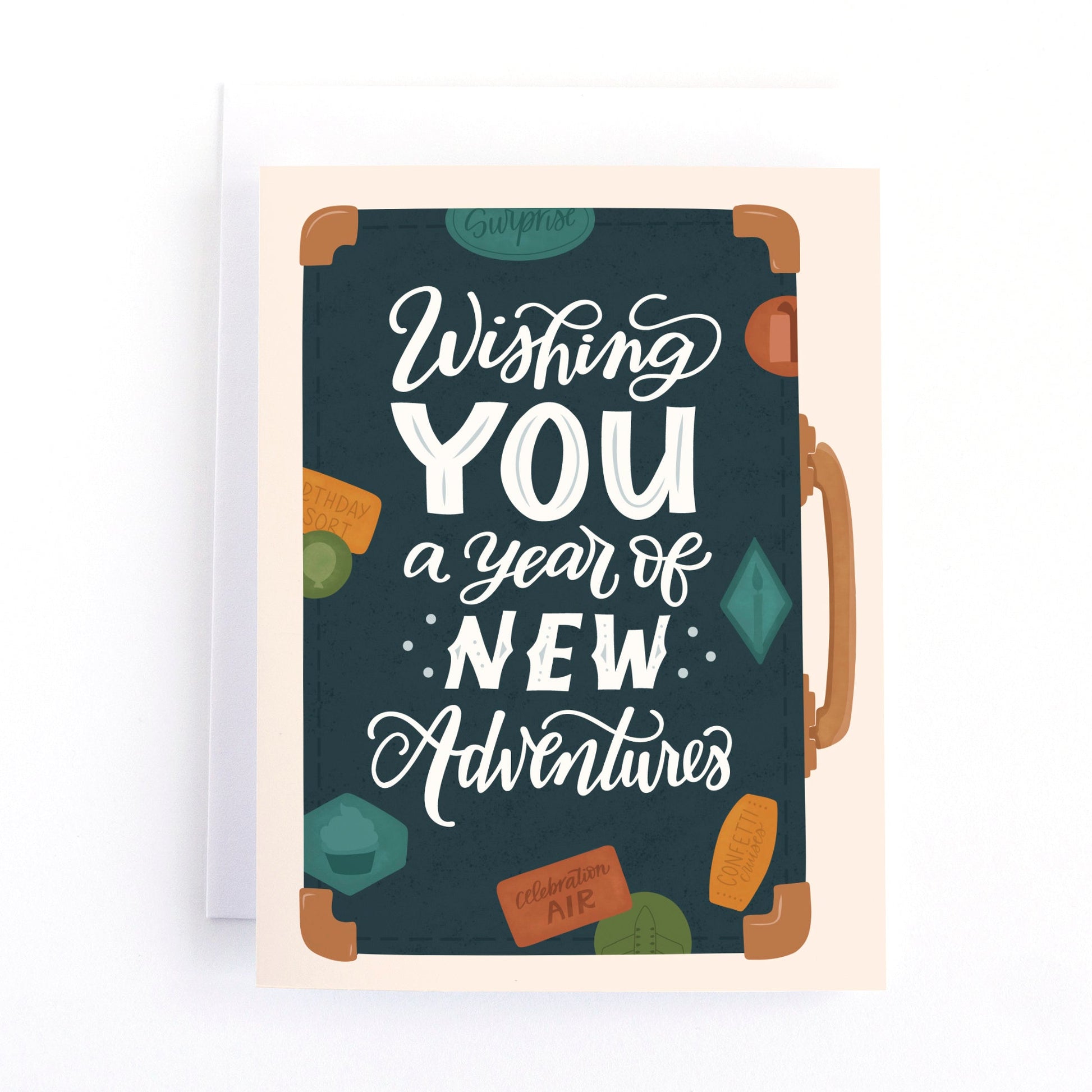 Birthday card featuring an illustration of a vintage suitcase with the text, wishing you a year of new adventures