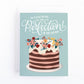 Blue birthday card with a layered birthday cake with a flowers that has the message, You deserve nothing less than perfection on your birthday!